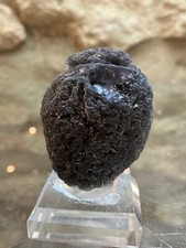 Listing image for Tektite mineral Tektites Indonesia 38 grams set on Glass Display Base